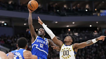 Milwaukee Bucks forward Taurean Prince shoots against Indiana Pacers guard Bennedict Mathurin during the third quarter at Fiserv Forum on Saturday.