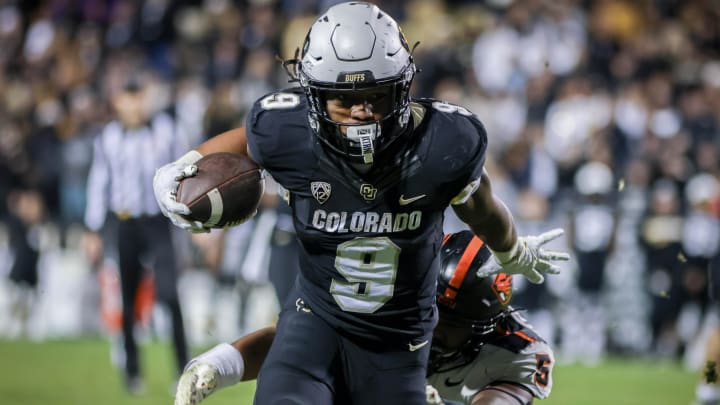 Nov 4, 2023; Boulder, Colorado, USA; Colorado Buffaloes running back Anthony Hankerson (9) breaks a tackle by Oregon State Beavers linebacker Easton Mascarenas-Arnold (5) for a touchdown at Folsom Field. Mandatory Credit: Chet Strange-USA TODAY Sports