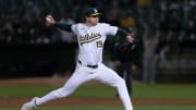 Jun 21, 2024; Oakland, California, USA; Oakland Athletics pitcher Mason Miller (19) pitches against the Minnesota Twins during the ninth inning at Oakland-Alameda County Coliseum. Mandatory Credit: Stan Szeto-USA TODAY Sports