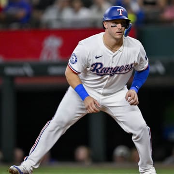 Jul 6, 2024; Arlington, Texas, USA; Texas Rangers catcher Andrew Knizner (12) in action during the game between the Texas Rangers and the Tampa Bay Rays at Globe Life Field. Mandatory Credit: Jerome Miron-USA TODAY Sports