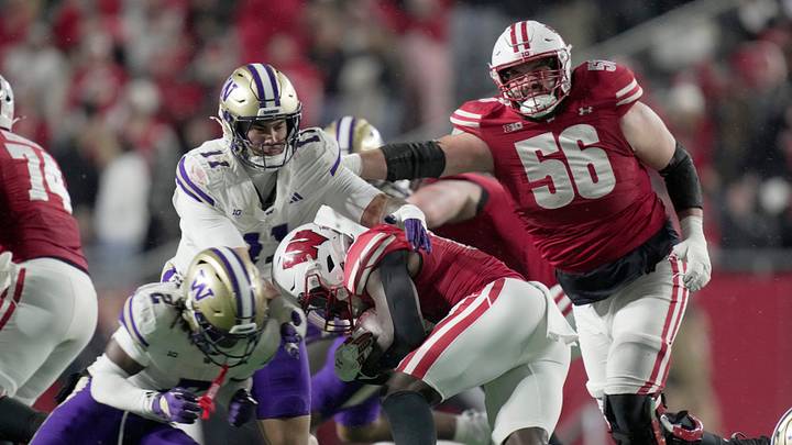 Wisconsin offensive lineman Joe Brunner (56) blocks for running back Gideon Ituka (10) during the third quarter of their game Saturday, November 8, 2025 at Camp Randall Stadium in Madison, Wisconsin. Wisconsin beat Washington 13-10.