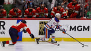 Jun 10, 2024; Sunrise, Florida, USA; Edmonton Oilers forward Connor McDavid (97) controls the puck against Florida Panthers forward Steven Lorentz (18) during the first period in game two of the 2024 Stanley Cup Final at Amerant Bank Arena. Mandatory Credit: Sam Navarro-USA TODAY Sports