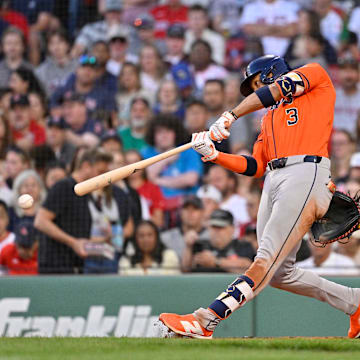 Aug 1, 2025; Boston, Massachusetts, USA; Houston Astros shortstop Jeremy Pena (3) hits a single against the Boston Red Sox during the third inning at Fenway Park. 