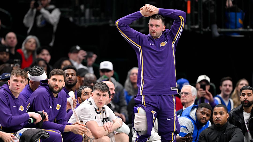 Jan 24, 2026; Dallas, Texas, USA; Los Angeles Lakers guard Luka Doncic (77) looks on from the team bench during the second quarter against the Dallas Mavericks at the American Airlines Center. Mandatory Credit: Jerome Miron-Imagn Images