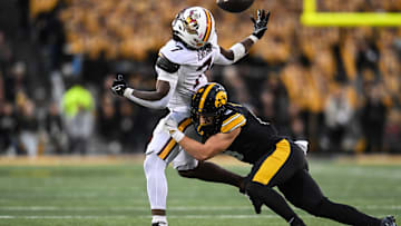 Oct 25, 2025; Iowa City, Iowa, USA; Iowa Hawkeyes defensive back Zach Lutmer (6) breaks up the pass for Minnesota Golden Gophers running back Fame Ijeboi (7) during the fourth quarter at Kinnick Stadium. Mandatory Credit: Jeffrey Becker-Imagn Images