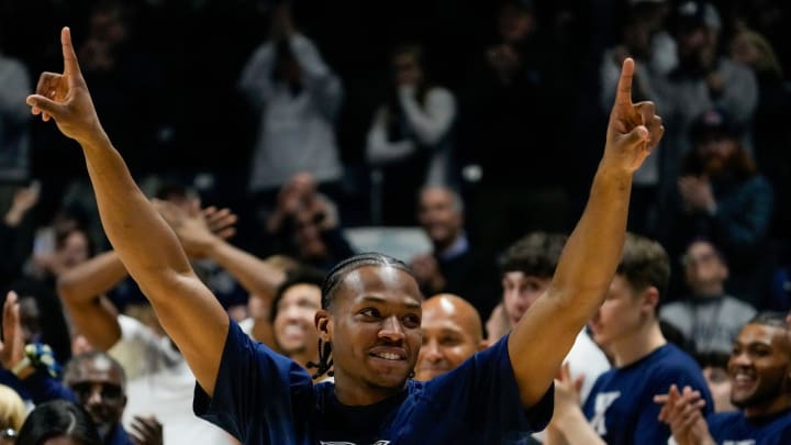 Xavier Musketeers guard Quincy Olivari (8) is honored on Senior Night before the first half of the NCAA Big East basketball game between the Xavier Musketeers and the Marquette Golden Eagles at Cintas Center in Cincinnati on Saturday, March 9, 2024.