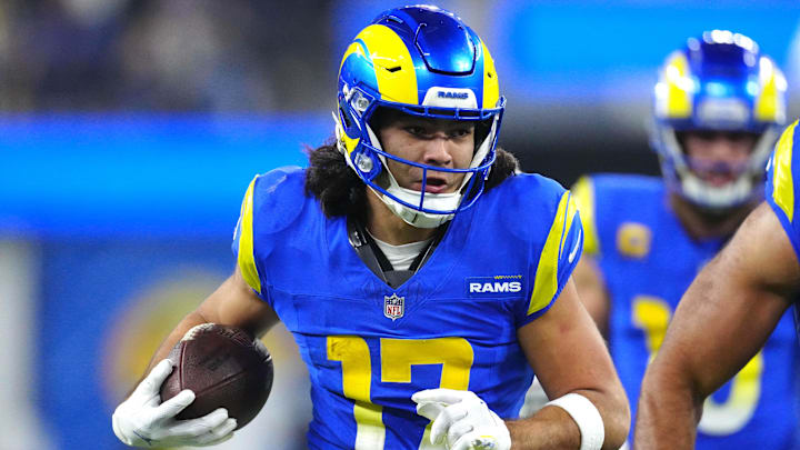 Los Angeles Rams receiver Puka Nacua runs with the ball during a game. Los Angeles Rams receiver Puka Nacua runs with the ball during a game.