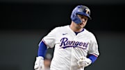 Aug 4, 2025; Arlington, Texas, USA; Texas Rangers pinch hitter Joc Pederson (4) rounds the bases after he hits a game tying home run against the New York Yankees during the ninth inning at Globe Life Field. 