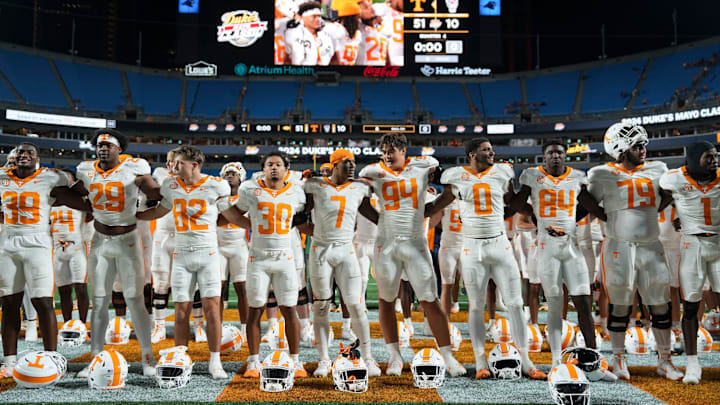 Tennessee players gather for the playing of the Tennessee Waltz after the win over NC State in the Dukes Mayo Classic NCAA College football game on Saturday, Sept. 7, 2024 in Charlotte, NC.