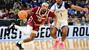 Troy Trojans guard Tayton Conerway (12) drives to the hoop past Kentucky Wildcats guard Lamont Butler (1) during the second half at Fiserv Forum.