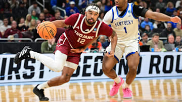 Troy Trojans guard Tayton Conerway (12) drives to the hoop past Kentucky Wildcats guard Lamont Butler (1) during the second half at Fiserv Forum.