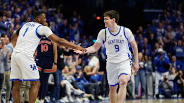 Mar 1, 2025; Lexington, Kentucky, USA; Kentucky Wildcats forward Trent Noah (9) celebrates with guard Lamont Butler (1) during the first half against the Auburn Tigers at Rupp Arena at Central Bank Center. Mandatory Credit: Jordan Prather-Imagn Images