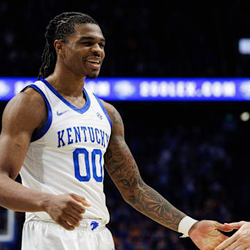 Feb 11, 2025; Lexington, Kentucky, USA; Kentucky Wildcats guard Otega Oweh (00) fives a teammate during the second half against the Tennessee Volunteers at Rupp Arena at Central Bank Center. Mandatory Credit: Jordan Prather-Imagn Images