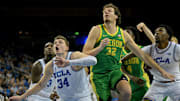 Dec 6, 2025; Los Angeles, California, USA;  UCLA Bruins forward Tyler Bilodeau (34) boxes out Oregon Ducks center Nate Bittle (32) during the second half at Pauley Pavilion presented by Wescom Financial. Mandatory Credit: Jayne Kamin-Oncea-Imagn Images