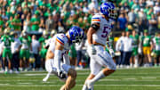 Boise State linebackers Marco Notarainni (53) and Boen Phelps celebrate a fourth-down stop.