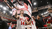 Oct 22, 2025; Chicago, Illinois, USA;  Chicago Bulls forward Matas Buzelis (14) greets fans after the game against the Detroit Pistons at United Center. Mandatory Credit: Matt Marton-Imagn Images