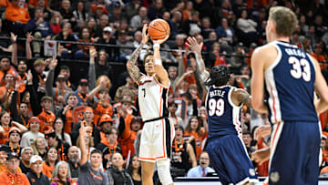 Jan 16, 2025; Corvallis, Oregon, USA; Oregon State Beavers guard Nate Kingz (7) shoots the ball against defensive pressure by Gonzaga Bulldogs guard Khalif Battle (99) during the first half at Gill Coliseum. Mandatory Credit: Craig Strobeck-Imagn Images
