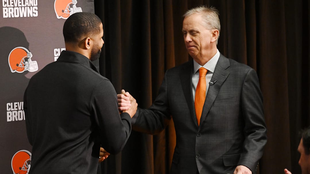 Feb 3, 2026; Berea, OH, USA; Executive vice president, football operations and general manager  Andrew Berry, left, shakes hands with new head coach Todd Monken during an introductory press conference at CrossCountry Mortgage Campus. Mandatory Credit: Ken Blaze-Imagn Images