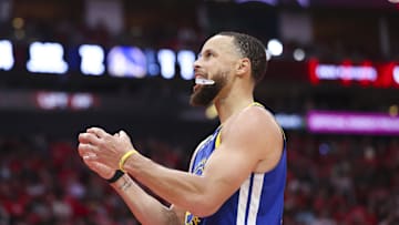 Golden State Warriors guard Stephen Curry reacts after a play during the fourth quarter against the Houston Rockets.