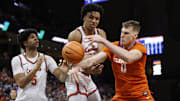 Mar 1, 2025; Charlottesville, Virginia, USA; Clemson Tigers center Viktor Lakhin (0) battles for a rebound with Virginia Cavaliers forward Anthony Robinson (21) and Cavaliers forward Jacob Cofie (5) during the second half at John Paul Jones Arena. 