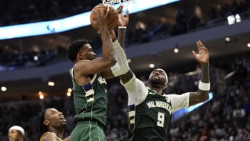 Apr 30, 2024; Milwaukee, Wisconsin, USA;  Milwaukee Bucks guard Malik Beasley (5) and forward Bobby Portis (9) reach for a rebound during the fourth quarter against the Indiana Pacers during game five of the first round for the 2024 NBA playoffs at Fiserv Forum. Mandatory Credit: Jeff Hanisch-USA TODAY Sports