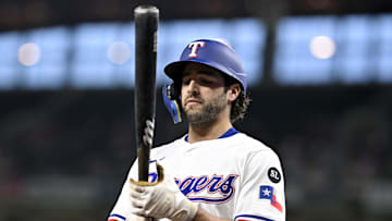 Sep 24, 2025; Arlington, Texas, USA; Texas Rangers shortstop Josh Smith (8) walks to the on deck circle during the first inning against the Minnesota Twins at Globe Life Field. Mandatory Credit: Jerome Miron-Imagn Images