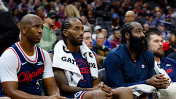 Oct 15, 2025; Sacramento, California, USA; Los Angeles Clippers guard Chris Paul (3) and forward Kawhi Leonard (2) and guard James Harden (1) sit on the bench during the fourth quarter against the Sacramento Kings at Golden 1 Center. Mandatory Credit: Sergio Estrada-Imagn Images