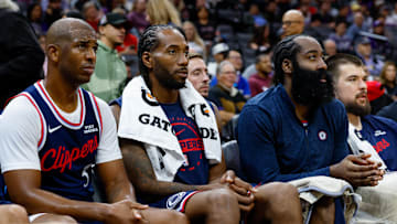 Oct 15, 2025; Sacramento, California, USA; Los Angeles Clippers guard Chris Paul (3) and forward Kawhi Leonard (2) and guard James Harden (1) sit on the bench during the fourth quarter against the Sacramento Kings at Golden 1 Center. Mandatory Credit: Sergio Estrada-Imagn Images