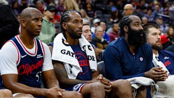 Oct 15, 2025; Sacramento, California, USA; Los Angeles Clippers guard Chris Paul (3) and forward Kawhi Leonard (2) and guard James Harden (1) sit on the bench during the fourth quarter against the Sacramento Kings at Golden 1 Center. Mandatory Credit: Sergio Estrada-Imagn Images