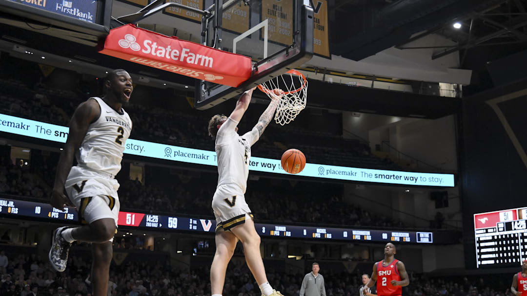 Dec 3, 2025; Nashville, Tennessee, USA;  Vanderbilt Commodores guard Duke Miles (2) reacts after a dunk by forward Tyler Nickel (5) against the Southern Methodist University Mustangs during the second half at Memorial Gymnasium. Mandatory Credit: Steve Roberts-Imagn Images