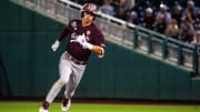 Jun 19, 2024; Omaha, NE, USA; Texas A&M Aggies shortstop Ali Camarillo (2) rounds second after hitting a triple against the Florida Gators during the ninth inning at Charles Schwab Field Omaha. 