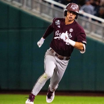 Jun 19, 2024; Omaha, NE, USA; Texas A&M Aggies shortstop Ali Camarillo (2) rounds second after hitting a triple against the Florida Gators during the ninth inning at Charles Schwab Field Omaha. 