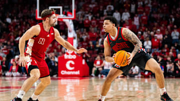 Feb 9, 2025; Lincoln, Nebraska, USA; Ohio State Buckeyes guard John Mobley Jr. (0) looks to shoot against Nebraska Cornhuskers guard Sam Hoiberg (1) during the second half at Pinnacle Bank Arena. Mandatory Credit: Dylan Widger-Imagn Images