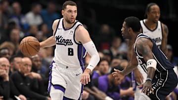 Mar 3, 2025; Dallas, Texas, USA; Sacramento Kings guard Zach LaVine (8) looks to move the ball past Dallas Mavericks guard Kyrie Irving (11) during the first quarter at the American Airlines Center. Mandatory Credit: Jerome Miron-Imagn Images