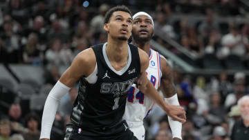 Apr 7, 2024; San Antonio, Texas, USA;  San Antonio Spurs center Victor Wembanyama (1) blocks out Philadelphia 76ers forward Paul Reed (44) in the second half at Frost Bank Center. Mandatory Credit: Daniel Dunn-USA TODAY Sports