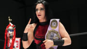 Stephanie Vaquer holding the NJPW Strong Women's Championship.
