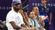 LeBron James watches the women's 3x3 basketball pool round game between the United States and Spain at Esplanade Des Invalides.