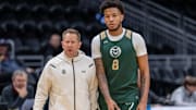 Mar 20, 2025; Seattle, WA, USA; Colorado State Rams head coach Niko Medved, and forward Jaylen Crocker-Johnson (8) are pictured during practice at Climate Pledge Arena. Mandatory Credit: Stephen Brashear-Imagn Images