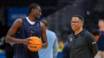 Mar 20, 2025; Seattle, WA, USA; Liberty Flameshead coach Ritchie McKay talks with forward Isaiah Ihnen (7) during practice at Climate Pledge Arena. Mandatory Credit: Stephen Brashear-Imagn Images