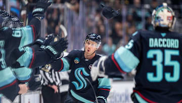 Jan 18, 2025; Seattle, Washington, USA;  Seattle Kraken forward Jaden Schwartz (17) celebrates after scoring a empty-net goal for a hat trick during the third period against the Los Angeles Kings at Climate Pledge Arena. Mandatory Credit: Stephen Brashear-Imagn Images