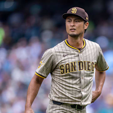 Aug 27, 2025; Seattle, Washington, USA; San Diego Padres starting pitcher Yu Darvish (11) walks off the field during a game against the Seattle Mariners  at T-Mobile Park. Mandatory Credit: Stephen Brashear-Imagn Images