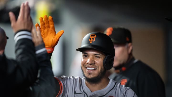 Aug 23, 2024; Seattle, Washington, USA; San Francisco Giants second baseman Thairo Estrada (39) celebrates in the dugout after scoring a run during the second inning against the Seattle Mariners at T-Mobile Park. 