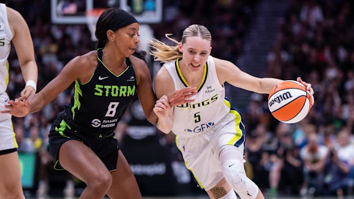 Jul 22, 2025; Seattle, Washington, USA; Dallas Wings guard Paige Bueckers (5) dribbles the ball against Seattle Storm guard Lexie Brown (8) during the second half at Climate Pledge Arena. Mandatory Credit: Stephen Brashear-Imagn Images Jul 22, 2025; Seattle, Washington, USA; Dallas Wings guard Paige Bueckers (5) dribbles the ball against Seattle Storm guard Lexie Brown (8) during the second half at Climate Pledge Arena. Mandatory Credit: Stephen Brashear-Imagn Images