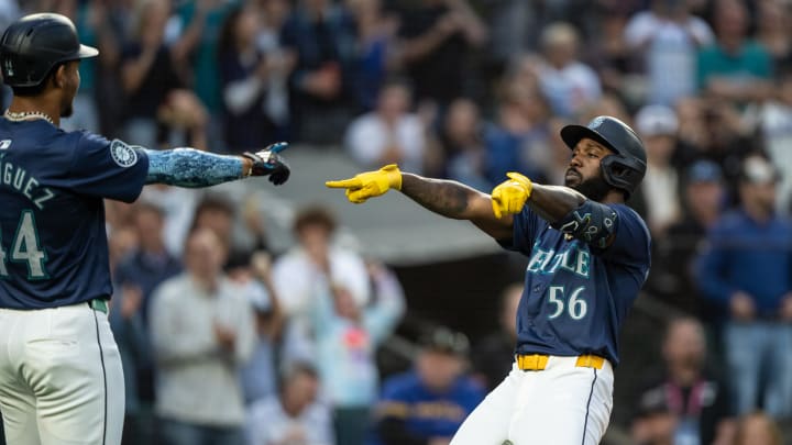 Seattle Mariners left fielder Randy Arozarena (right) celebrates after hitting a three-run home run against the Tampa Bay Rays on Monday at T-Mobile Park.