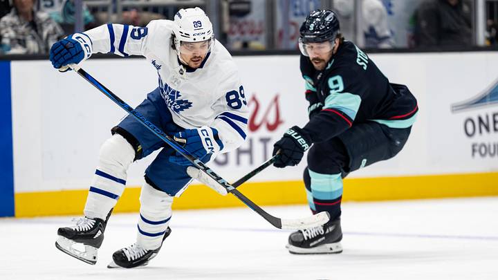 Feb 6, 2025; Seattle, Washington, USA;  Toronto Maple Leafs forward Nicholas Robertson (89) skates against Seattle Kraken forward Chandler Stephenson (9) during the second periodat Climate Pledge Arena. Mandatory Credit: Stephen Brashear-Imagn Images