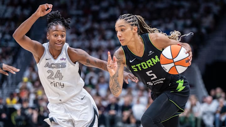Sep 16, 2025; Seattle, Washington, USA; Seattle Storm forward Gabby Williams (5) dribbles the ball against Las Vegas Aces guard Jewell Loyd (24) in the first half during game two of round one for the 2025 WNBA Playoffs at Climate Pledge Arena. Mandatory Credit: Stephen Brashear-Imagn Images