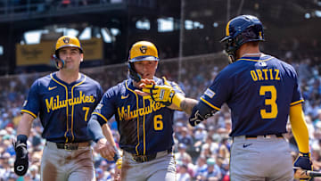 Jul 23, 2025; Seattle, Washington, USA;  Milwaukee Brewers left fielder Isaac Collins (6) and first baseman Tyler Black (7) are congratulated by shortstop Joey Ortiz (3) after scoring runs during the second inning against the Seattle Mariners at T-Mobile Park. Mandatory Credit: Stephen Brashear-Imagn Images
