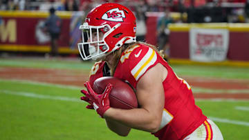 Kansas City Chiefs running back Carson Steele (42) returns a kick against the New Orleans Saints during the second half at GEHA Field at Arrowhead Stadium.