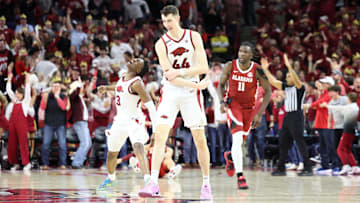 Feb 8, 2025; Fayetteville, Arkansas, USA; Arkansas Razorbacks forwards Adou Thiero (3) and Zvonimir Ivisic (44) celebrate after a three point shot in the second half by Ivisic as Alabama Crimson Tide center Clifford Omoruyi (11) looks on at Bud Walton Arena. Alabama won 85-81. Mandatory Credit: Nelson Chenault-Imagn Images