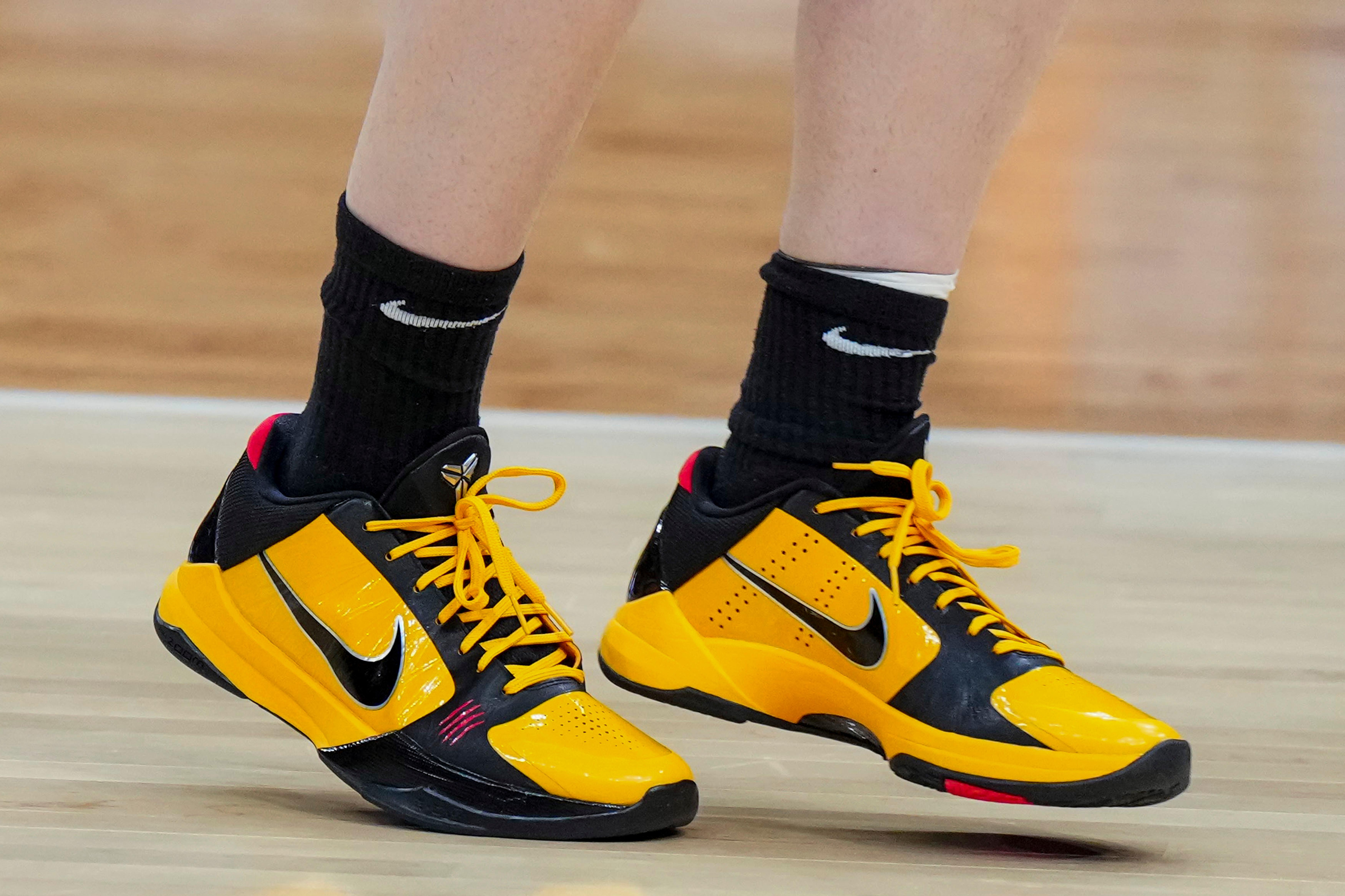 Iowa Hawkeyes guard Caitlin Clark's black and gold Nike sneakers.